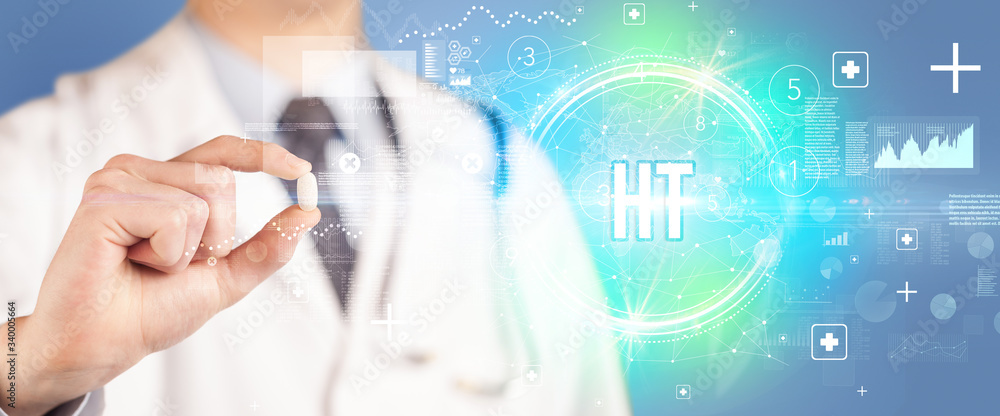Close-up of a doctor giving you a pill with HT abbreviation, virology concept Close-up of a doctor giving you a pill with HT abbreviation, virology concept