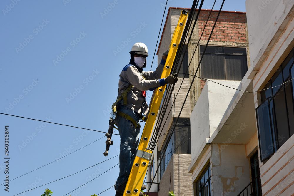 telephone worker waring mask to prevent the spread of virus in Lima-Peru telephone worker waring mask to prevent the spread of virus in Lima-Peru