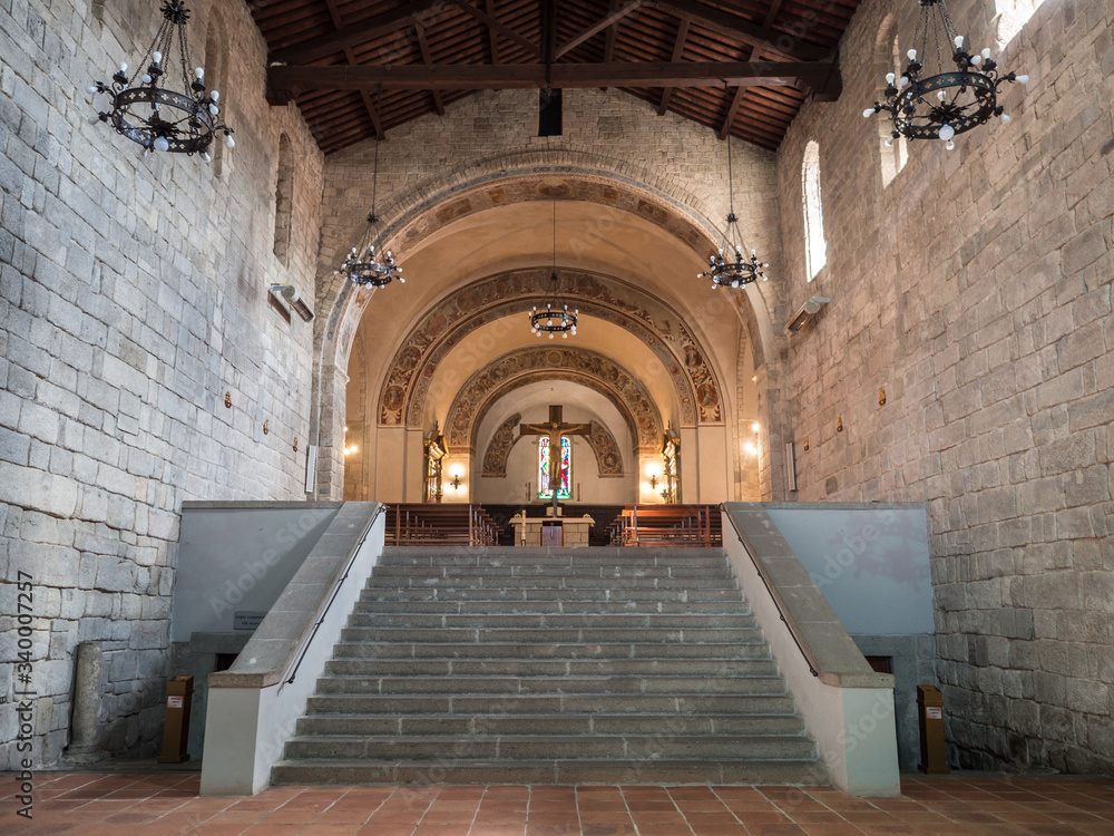 Interior of the medieval abbey of Abbadia San Salvatore, Italy. Stairway leading to the altar and side entrances to the underground crypt.