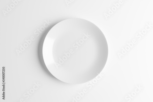 Empty white plate or ceramic dish isolated on white background. 3D rendering with clipping path