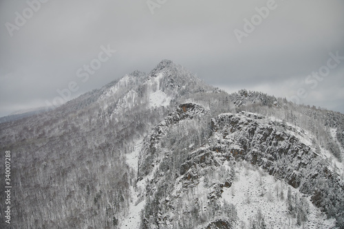 snow coniferous trees in the mountains of the Urals on top of mount aigir. photo