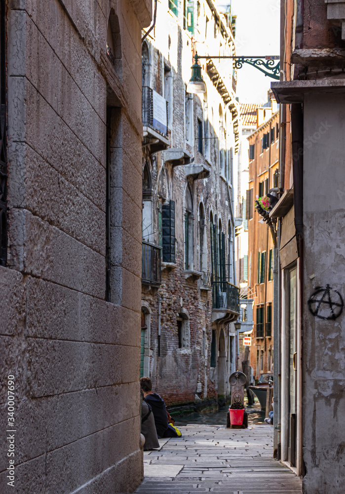 The quiet narrow street away from Piazza San Marco in Venice, Italy