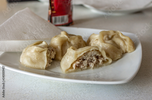 Steamed Asian dish with meat filling (mantas).