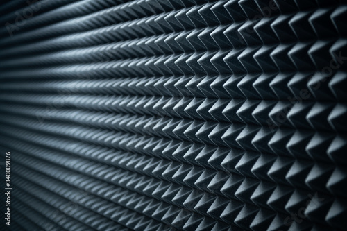 Grey dampening acoustic foam in the vocal recording room.