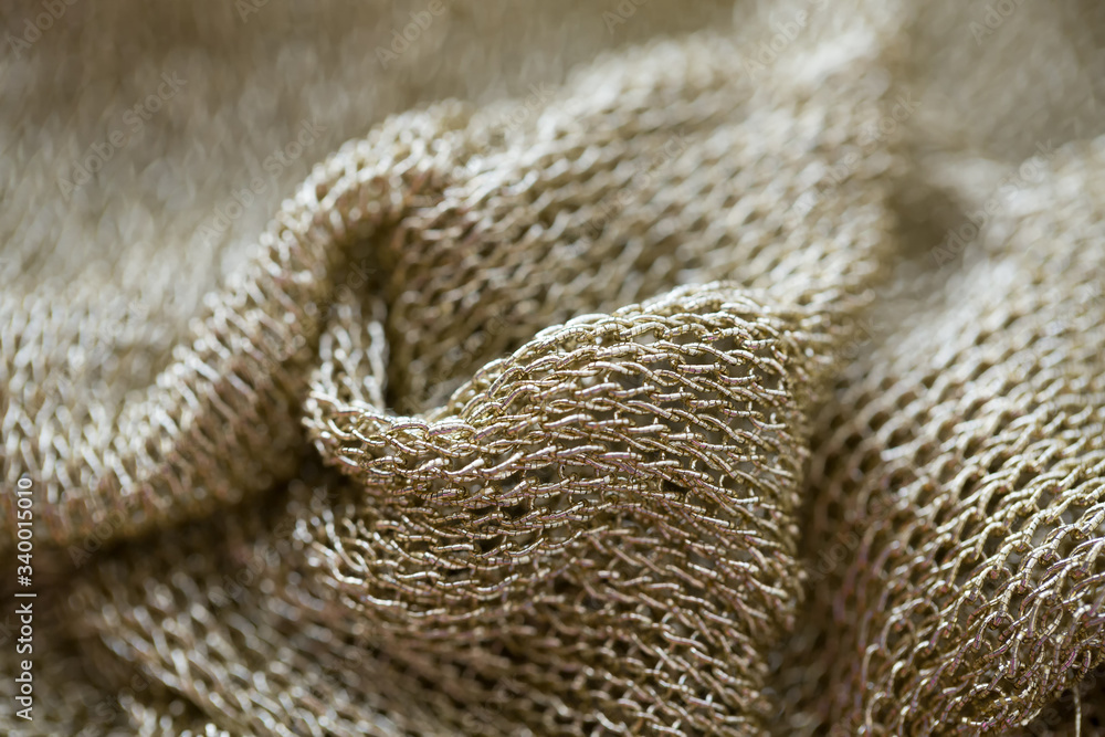 beautiful fabric in the form of a gold mesh that looks like chain mail
beautiful fabric in the form of a gold mesh that looks like chain mail