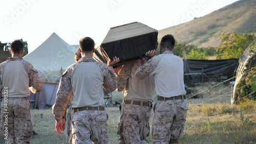 Funeral of a friend. The coffin is carried on the shoulders of soldiers