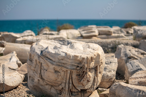 Close up of the ruins at Side, Antalya with the Mediterranean sea as the backdrop.