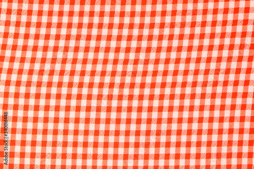 Chequered red-white background. Chequered red-white Synthetic fabric texture, background. Red fabric