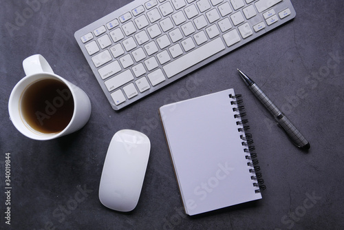 high angle view of notepad keyboard and mouse on table 