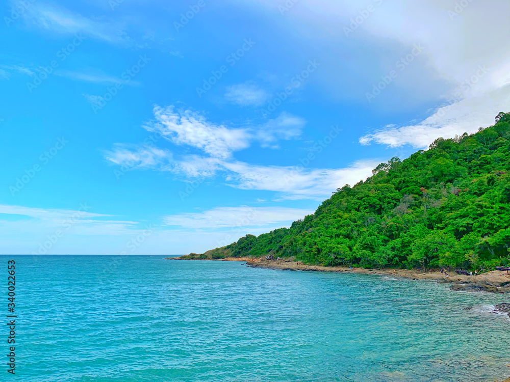 Fototapeta premium Beach and sea with blue sky background.Sand on the beach beautiful sky.Close up.