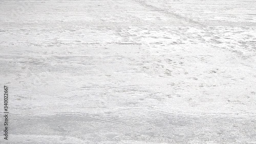 Abstract closeup of blue ice river on white background.