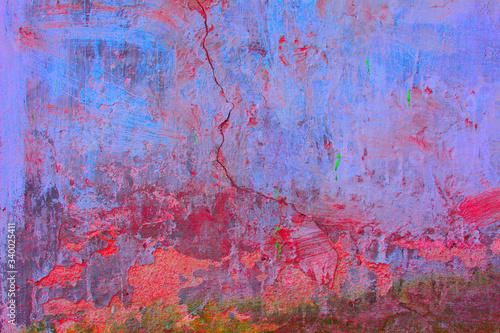 Old concrete wall covered with colorful paint