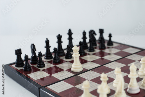 The chess game. White queen is advancing. The concept of a fearless person, not ready to compromise in life and business.