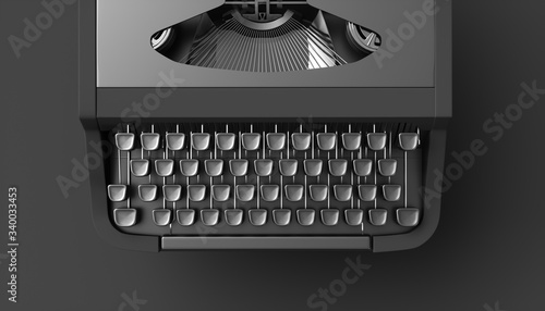 black typewriter on a black background photo