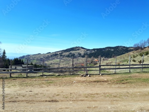 Landscape with wooden fence and mountains
