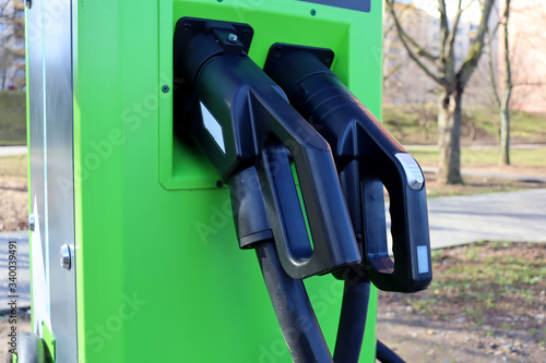 Wallpaper Mural Recharging electrical machines. Gun for charging electric cars Torontodigital.ca