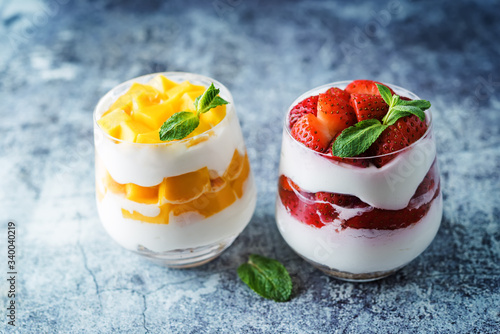 Greek yogurt strawberry and mango parfait in glasses