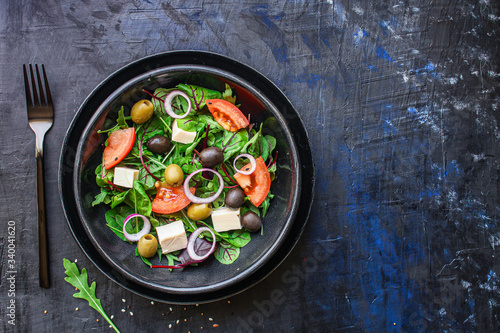 healthy salad
olives, lettuce, tomato and cheese
feta (greek salad, tasty vegetables snack) menu concept background. top view. copy space for text