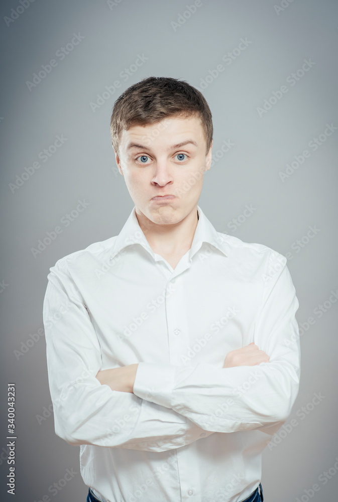 Portrait of disgusted man looking at the camera Portrait of disgusted man looking at the camera