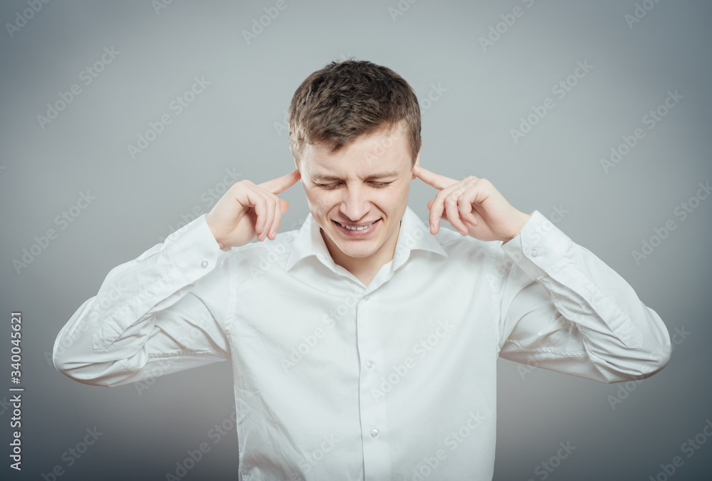 Man covering his hears Man covering his hears