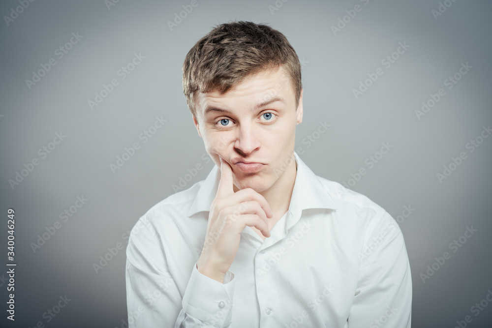 young businessman scratching his head, hard decision, studio shoot young businessman scratching his head, hard decision, studio shoot