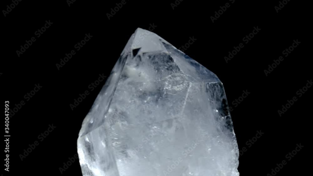 Healing crystal stone macro mineral, white rough quartz crystals on black background. Mystery jewelry from nature. rotation crystal Healing crystal stone macro mineral, white rough quartz crystals on black background. Mystery jewelry from nature. rotation crystal