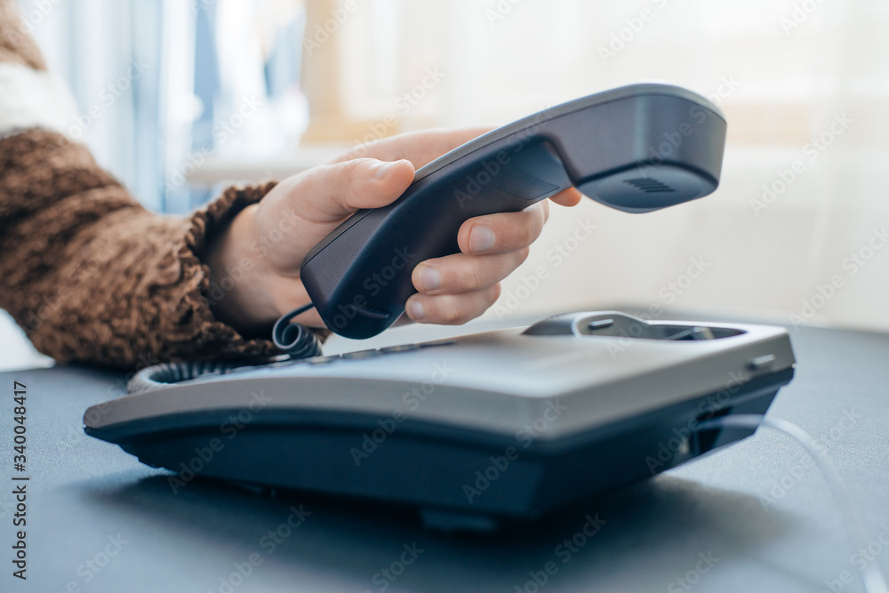 Fototapeta premium man holding a telephone tube