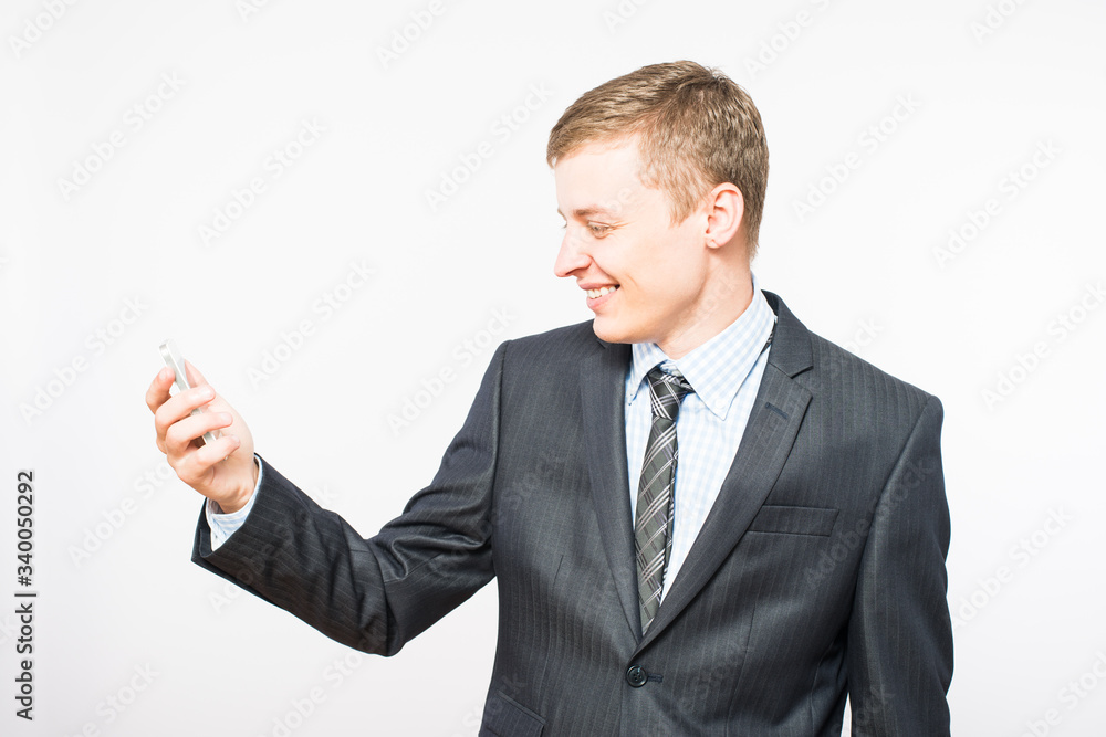 Young smiling businessman with mobile phone Young smiling businessman with mobile phone