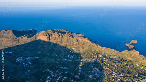 Beautiful panoramic aerial view photo from flying drone on Vulcano Island to Lipari and Salina Island of the Aelian Islands, Italy on a summer with blue sky (series)