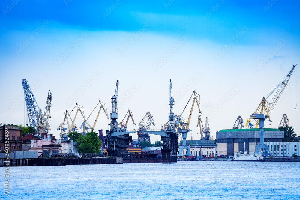 Panorama of Admiralty Shipyard or Admiralteyskiye Verfi, with construction cranes and deadweight, Saint Petersburg, Russia