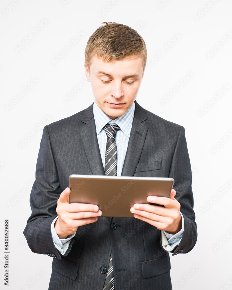 Casual Businessman Looking at a tablet Casual Businessman Looking at a tablet