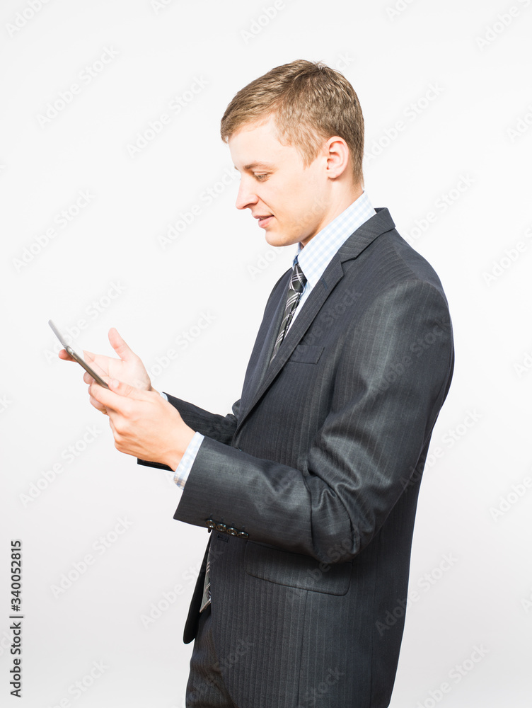 businessman at the table uses a digital tablet businessman at the table uses a digital tablet