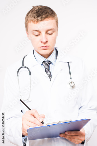 Portrait of a doctor writing a prescription