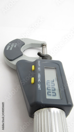 A isolated micrometer with a digital display,Located on white background,Easy to use in any work