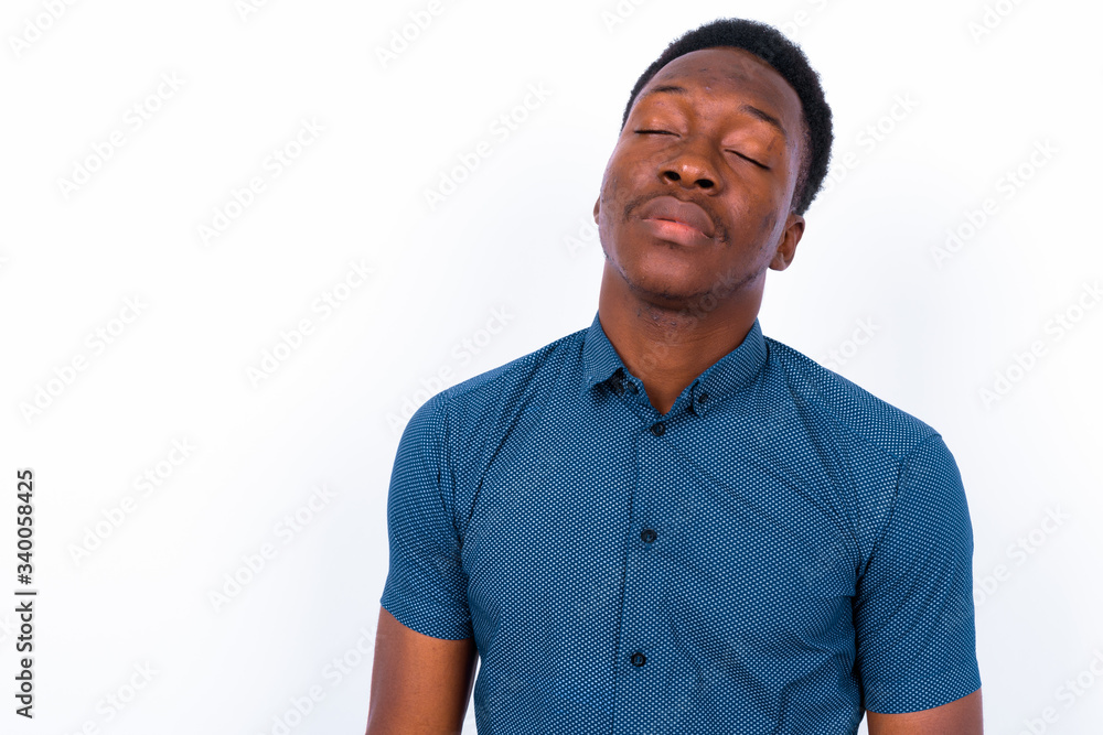 Young handsome African man against white background Young handsome African man against white background