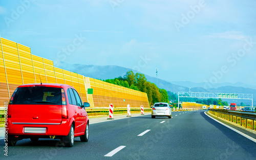 Red Car on highway road in Slovenia reflex