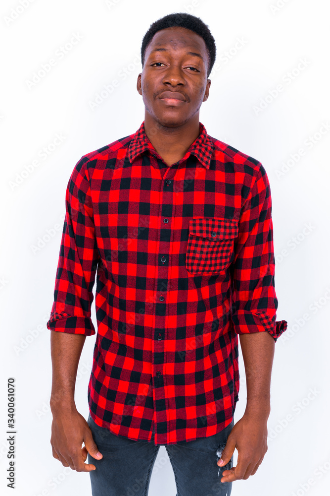 Fototapeta premium Young handsome African man against white background