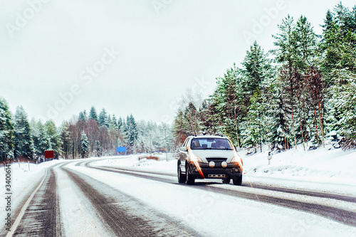 Car at winter road in Rovaniemi of Lapland Finalnd reflex © Roman Babakin