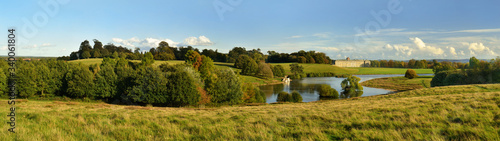 Quadro su tela Petworth Park House in Landscape created by Capability Brown at the end of the day, sunset, England, Great Britain