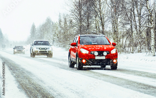 Car in winter road in Rovaniemi at Lapland reflex