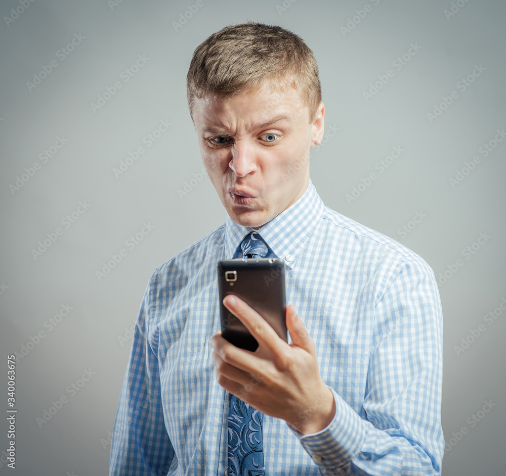 Young man speak, shouts, by mobile Young man speak, shouts, by mobile