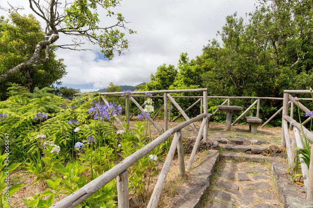 A wooden fence on the viewing point in the mountains of Madeira, Portugal A wooden fence on the viewing point in the mountains of Madeira, Portugal