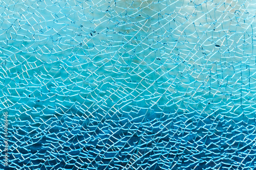 Broken blue glass wall texture background