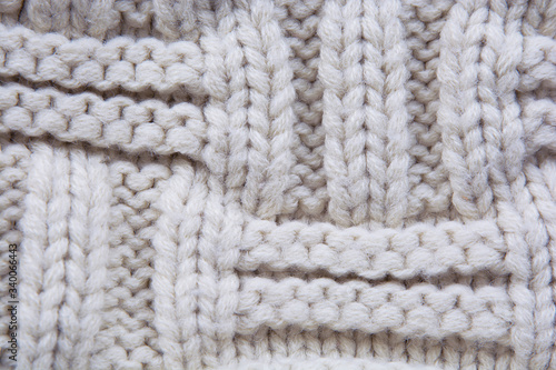 knitted pattern light beige closeup with soft blur
