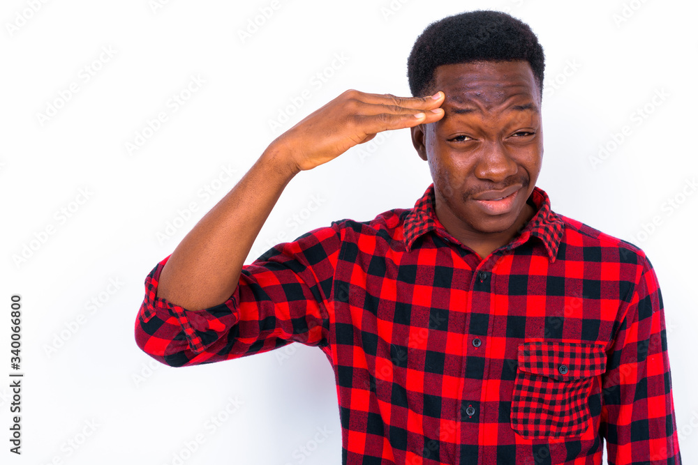 Fototapeta premium Young handsome African man against white background