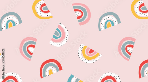 Pink rainbow pattern. Stylized seamless childish vector design for wallpapers, cards, wrapping paper. Dots and rainbows vector nursery texture. Soft pastel color hand-drawn pattern.