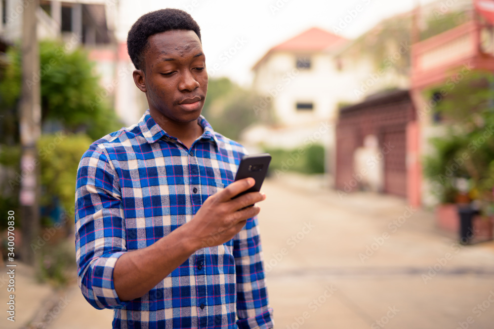 Young handsome African man exploring the city Young handsome African man exploring the city