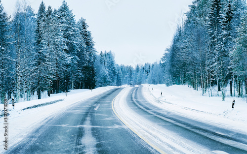 Road in snowy winter Lapland reflex