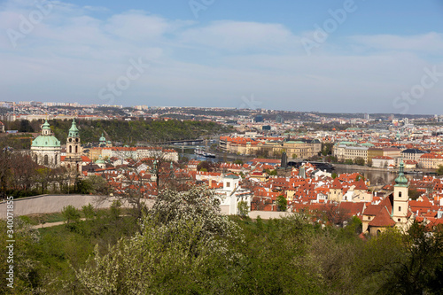 Spring Prague City with green Nature and flowering Trees from the Hill Petrin, Czech Republic