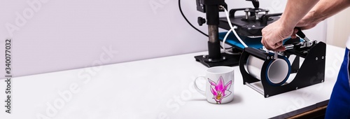 Printing on mugs in workshop photo